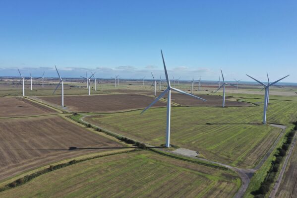 FILE - A general view of a wind farm, in England, Oct. 6, 2021. Britain’s government is relaxing planning rules and lifting restrictions that have effectively banned new onshore wind farms from being built in England. Under rules introduced in 2015 by former Conservative Prime Minister David Cameron, a single objection to a wind turbine application would block its development. (Tom Leese/PA via AP, File)