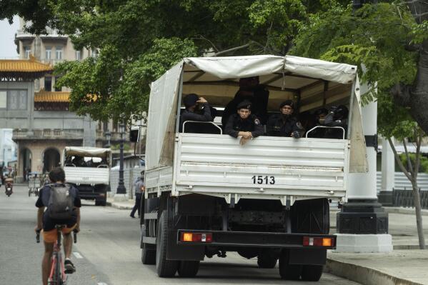 A truck of special forces police sits parked outside National Capitol building in Havana, Cuba, Wednesday, July 14, 2021, days after protests. Demonstrators voiced grievances on Sunday against goods shortages, rising prices and power cuts, and some called for a change of government. (AP Photo/Eliana Aponte)