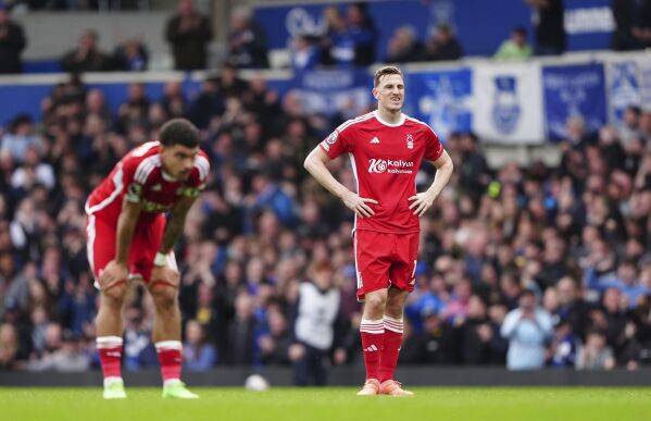 Nottingham Forest's Chris Wood and Nottingham Forest's Morgan Gibbs-White, left, show dejection during the English Premier League soccer match between Everton and Nottingham Forest at Goodison Park, Liverpool, England, Sunday April 21, 2024. (Peter Byrne/PA via AP)