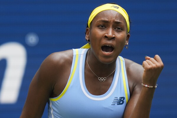 Coco Gauff, of the United States, reacts after scoring a point against Varvara Gracheva, of France, during the first round of the U.S. Open tennis championships, Monday, Aug. 26, 2024, in New York. (AP Photo/Seth Wenig)