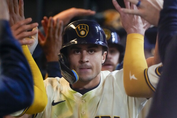 Milwaukee Brewers' Sal Frelick is congratulated after hitting a two-run home run during the second inning of a baseball game against the Pittsburgh Pirates Tuesday, May 14, 2024, in Milwaukee. (AP Photo/Morry Gash)
