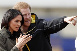 Britain's Prince Harry and his fiancee Meghan Markle attend the UK team trials for the Invictus Games Sydney 2018 at the University of Bath in Bath, England, Friday, April 6, 2018. The Invictus Games is the only international sport event for wounded, injured and sick (WIS) servicemen and women, both serving and veteran. The Invictus Games Sydney 2018 will take place from 20-27th October and will see over 500 competitors from 18 nations compete in 11 adaptive sports. (AP Photo/Frank Augstein)