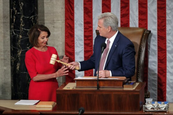 
              House speaker Nancy Pelosi of California, who will lead the 116th Congress as Speaker of the House is handed the gavel by Rep. Kevin McCarthy, R-Calif., at the U.S. Capitol in Washington, Thursday, Jan. 3, 2019. (AP Photo/Carolyn Kaster)
            