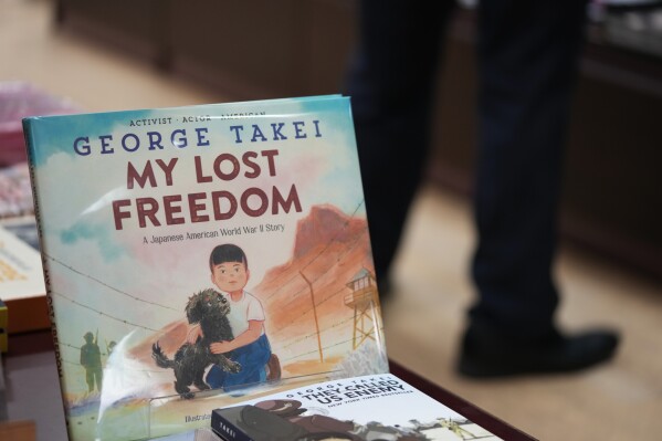 A copy of "My Lost Freedom," a children's book by George Takei, is displayed at the section featuring in the "Being Asian in America" at a Kinokuniya bookstore specializing in selling books and magazines written in foreign languages in the Shinjuku district of Tokyo, Wednesday, May 29, 2024. (AP Photo/Hiro Komae)