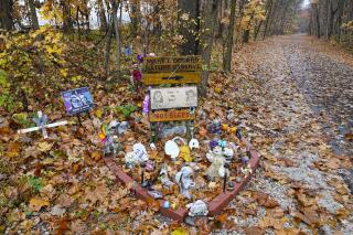 FILE - A makeshift memorial to Liberty German and Abigail Williams is pictured near where they were last seen and where the bodies were discovered along the Monon Trail leading to the Monon High Bridge Trail in Delphi, Ind., Oct. 31, 2022. Documents related to a man’s arrest in the 2017 killings of two teenage girls were unsealed Tuesday, Nov. 29, 2022 by an Indiana judge, allowing for the first public disclosure of evidence authorities have against the suspect since he was arrested last month. (AP Photo/Michael Conroy, File)