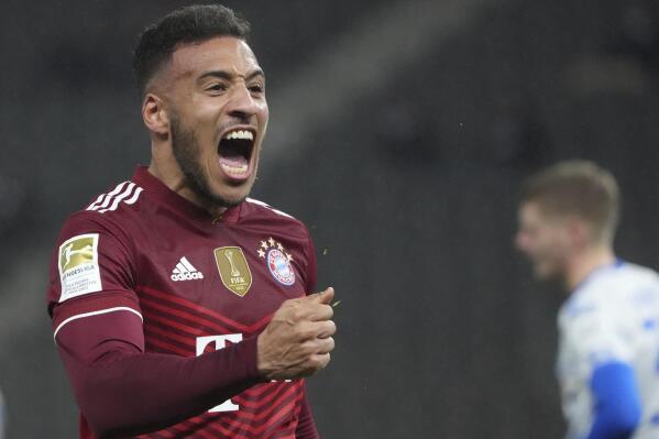 Bayern's Corentin Tolisso celebrates after scoring during the German Bundesliga soccer match between Hertha Berlin and Bayern Munich at the Olympiastadion in Berlin, Sunday, Jan. 23, 2022. (Soeren Stache/dpa via AP)