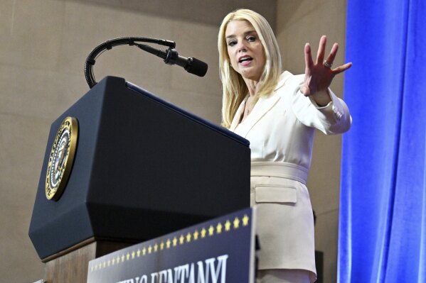 Attorney General Pam Bondi speaks before President Donald Trump at the Justice Department in Washington, Friday, March 14, 2025. (Pool via AP)