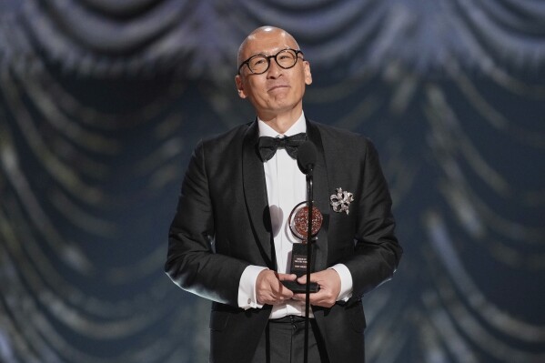 Francis Jue accepts the award for best performance by an actor in a featured role in a play for "Yellow Face during the 78th Tony Awards on Sunday, June 8, 2025, at Radio City Music Hall in New York. (Photo by Charles Sykes/Invision/AP)