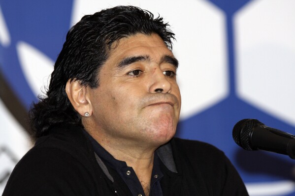 FILE - Argentina's national soccer team coach Diego Maradona attends a news conference in Caracas, Venezuela, Tuesday, Jan. 27, 2009. A medical examiner's report into the death of Maradona injected uncertainty Monday, April 29, 2024, into a case of criminal negligence brought against eight medical workers involved in his care, raising new questions just a month before the staffers are set to stand trial for homicide. (AP Photo/Carlos Hernandez, File)