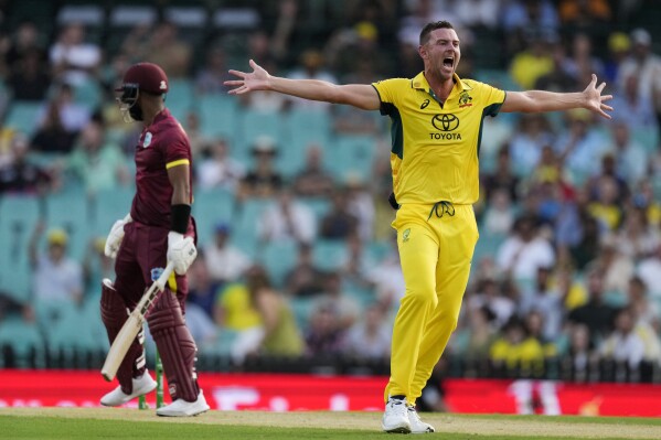 Australia's Josh Hazlewood, right, appeals for a LBW decision on the West Indies' Shai Hope, left, during their one day international cricket match in Sydney, Sunday, Feb. 4, 2024. (AP Photo/Rick Rycroft)