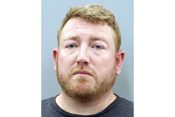 This booking photo provided by Houston Police Department shows Mason Herring, a 39-year-old Houston attorney, who pleaded guilty, Wednesday, Feb. 7, 2024, to injury to a child and assault of a pregnant person. He had initially been charged with felony assault to induce abortion. Herring was sentenced to 180 days in jail and 10 years on probation (Houston Police Department via AP)