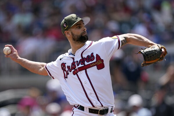 FILE - Atlanta Braves relief pitcher Nick Anderson (61) works in the eighth inning of a baseball game against the Seattle Mariners, Sunday, May 21, 2023, in Atlanta. The Braves jettisoned their third arbitration-eligible player in two days, trading right-hander Nick Anderson to the Kansas City Royals on Friday, Nov. 17, 2023, for cash. (AP Photo/John Bazemore, File)