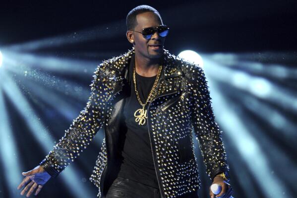 R. Kelly performs at the BET Awards at the Nokia Theatre on Sunday, June 30, 2013, in Los Angeles. The R&B superstar known for his anthem “I Believe I Can Fly,” was convicted Monday in a sex trafficking trial after decades of avoiding criminal responsibility for numerous allegations of misconduct with young women and children. (Photo by Frank Micelotta/Invision/AP)