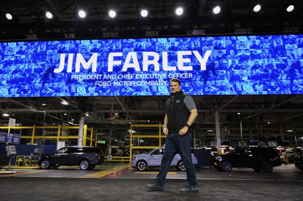Jim Farley, President and Chief Executive Officer of Ford, arrives on stage to speak at the Ford Motor Company Kentucky Truck Plant to launch the 2025 Ford Expedition, Wednesday, April 30, 2025, in Louisville, Ky. (AP Photo/Carolyn Kaster)