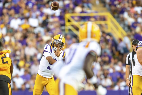 LSU quarterback Jayden Daniels (5) throws a pass against Grambling State during an NCAA college football game in Baton Rouge, La., Saturday, Sept. 9, 2023. (Scott Clause/The Daily Advertiser via AP)