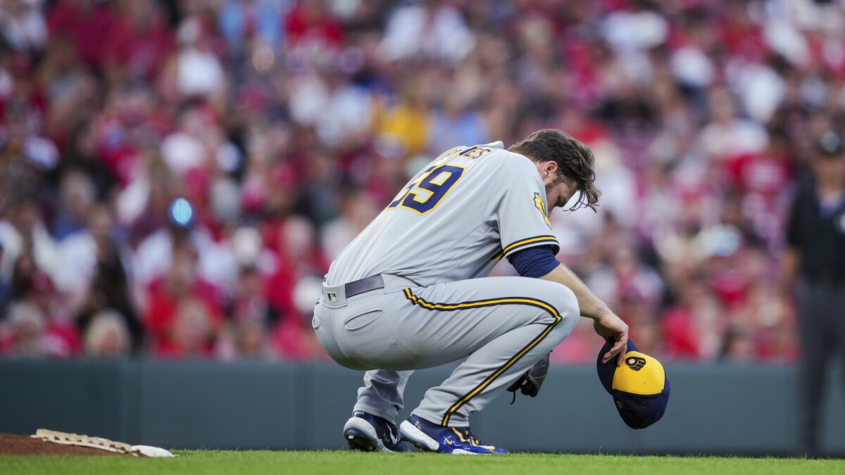 Milwaukee Brewers starting pitcher Corbin Burnes throws against the  Cincinnati Reds during the first inning of a spring training baseball game,  Monday, March 13, 2023, in Goodyear, Ariz. (AP Photo/Matt York Stock