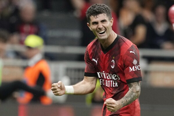 AC Milan's Christian Pulisic celebrates after scoring his side's fifth goal during the Serie A soccer match between AC Milan and Cagliari at the San Siro stadium, in Milan, Italy, Saturday, May 11, 2024. (AP Photo/Antonio Calanni)