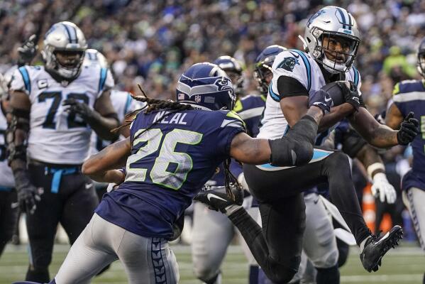 Seattle Seahawks quarterback Geno Smith (7) walks off the filed after an  NFL football game against the Carolina Panthers, Sunday, Dec. 11, 2022, in  Seattle, WA. The Panthers defeated the Seahawks 30-24. (