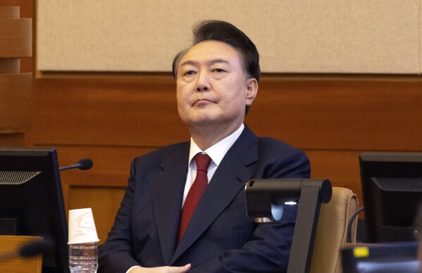 South Korea's impeached President Yoon Suk Yeol attends a hearing of his impeachment trial at the Constitutional Court in Seoul, South Korea, Thursday, Feb. 13, 2025. (Joen Heon-Kyun/Pool Photo via AP)