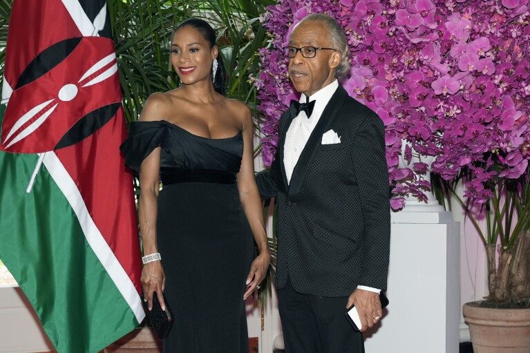Rev. Al Sharpton and Aisha McShaw arrive at the Booksellers area of the White House for the State Dinner hosted by President Joe Biden and first lady Jill Biden for Kenya's President William Ruto and Kenya's first lady Rachel Ruto, Thursday, May 23, 2024, in Washington. (AP Photo/Jacquelyn Martin)