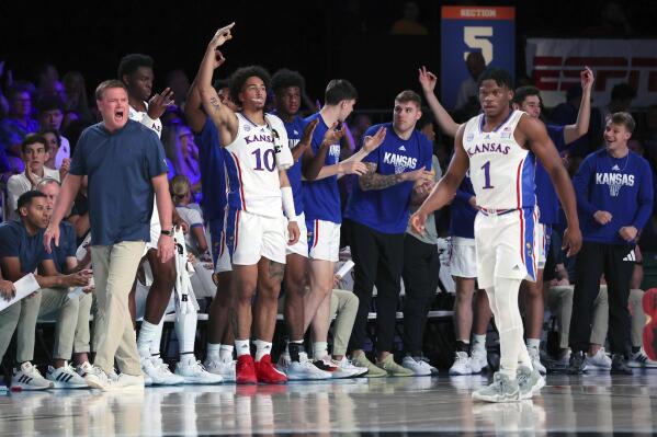 This photo provided by Bahamas Visual Services shows Kansas coach Bill Self, left, and members of his team reacting during an NCAA college basketball game against N.C. State at the Battle 4 Atlantis at Paradise Island, Bahamas, Wednesday, Nov. 23, 2022.(Tim Aylen/Bahamas Visual Services via AP)