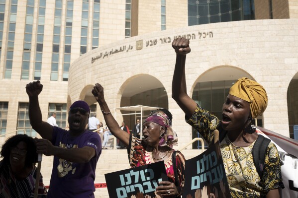 Members of the Hebrew Israelite community rally outside of the District Court in Beersheba, Israel, ahead of a hearing on the deportation orders for dozens from their community, Wednesday, July 19, 2023. Over the decades, the community has made inroads into Israeli society, and most of them have citizenship or residency rights. But 130 members remain undocumented, and Israeli authorities have ordered them to leave. The orders have left dozens of people, some of whom have lived most of their lives in Israel, in an uncertain legal limbo.(AP Photo/Maya Alleruzzo)