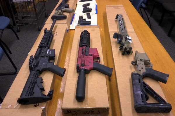 FILE - "Ghost guns" are displayed at the headquarters of the San Francisco Police Department, Nov. 27, 2019, in San Francisco. Nevada's Supreme Court upheld the state's ban on ghost guns Thursday, April 18, 2024, overturning a lower court's ruling that had sided with a gun manufacturer's' argument the 2021 law regulating firearm components with no serial numbers was too broad and unconstitutionally vague. (AP Photo/Haven Daley, File)