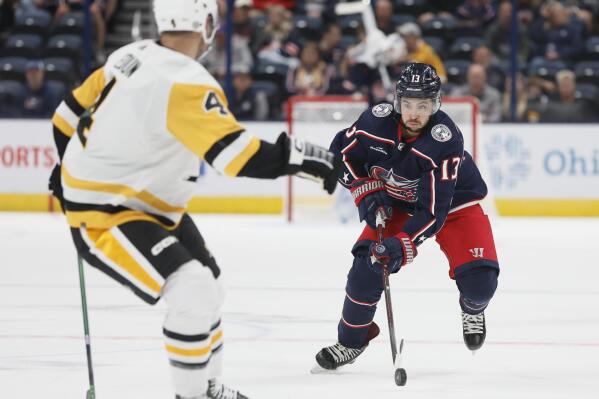Columbus Blue Jackets' Johnny Gaudreau, right, looks for an open pass against the Pittsburgh Penguins during the second period of a preseason NHL hockey game Sunday, Sept. 25, 2022, in Columbus, Ohio. (AP Photo/Jay LaPrete)