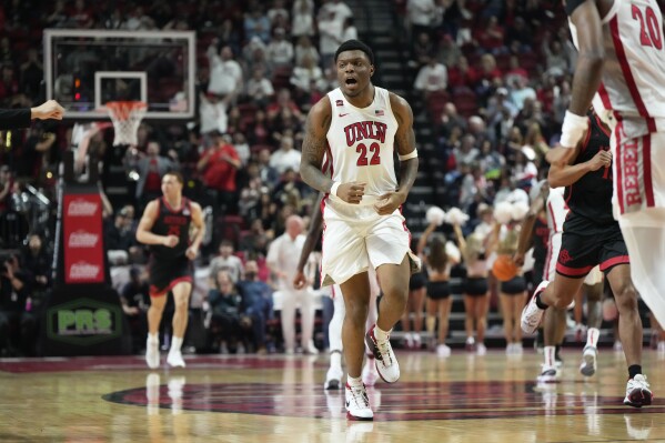 UNLV forward Karl Jones (22) reacts after scoring against San Diego State during the first half of an NCAA college basketball game Tuesday, March 5, 2024, in Las Vegas. (AP Photo/Lucas Peltier)