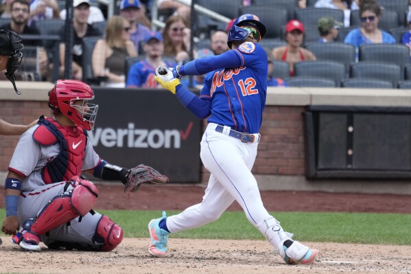 Jeff McNeil, of the New York Mets, flips his bat after being hit by a pitch  during the second inning of the MLB All-Star baseball game against the  American League, Tuesday, July