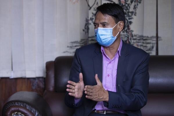 Nepalese Health Minister Sher Bahadur Tamang speaks during an interview with the Associated Press in Kathmandu, Nepal, Thursday, June 17, 2021. Nepal has been able to significantly lower reduce new coronavirus infections after its worst outbreak, but is in desperate need of vaccines, the health minister said Thursday. (AP Photos/Bikram Rai)