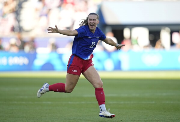 Samantha Coffey of the United States celebrates after defeating Brazil during the women's soccer gold medal match between Brazil and the United States at the Parc des Princes during the 2024 Summer Olympics, Saturday, Aug. 10, 2024, in Paris, France. (AP Photo/Francisco Seco)