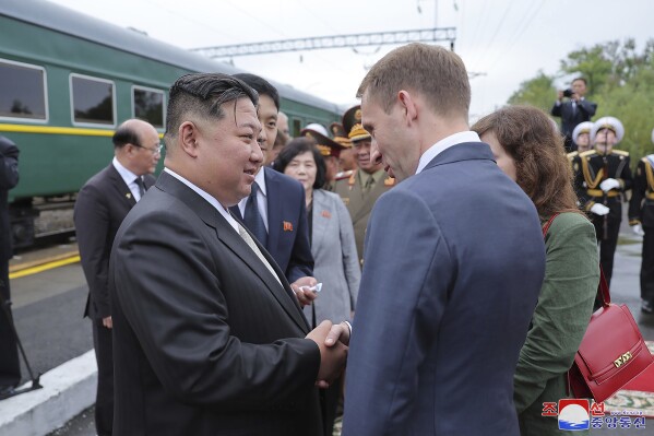 In this photo provided by the North Korean government, North Korea leader Kim Jong Un, front left, bids farewell to Russian Minister of Natural Resources and Ecology Alexander Kozlov, front right, at a station in Artyom, near Vladivostok, Russian Far East Sunday, Sept. 17, 2023. Independent journalists were not given access to cover the event depicted in this image distributed by the North Korean government. The content of this image is as provided and cannot be independently verified. Korean language watermark on image as provided by source reads: 