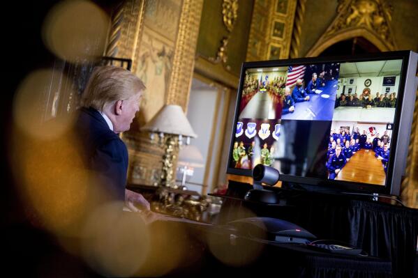 FILE - President Donald Trump speaks during a Christmas Eve video teleconference with members of the military at his Mar-a-Lago estate in Palm Beach, Fla., Tuesday, Dec. 24, 2019. A Las Vegas city councilwoman has been spending thousands on television ads in her quest to be Nevada's next governor. But Michele Fiore isn't only airing those ads to be seen by millions of Nevada voters. She's also targeting an audience of one in faraway Florida.   (AP Photo/Andrew Harnik.File)