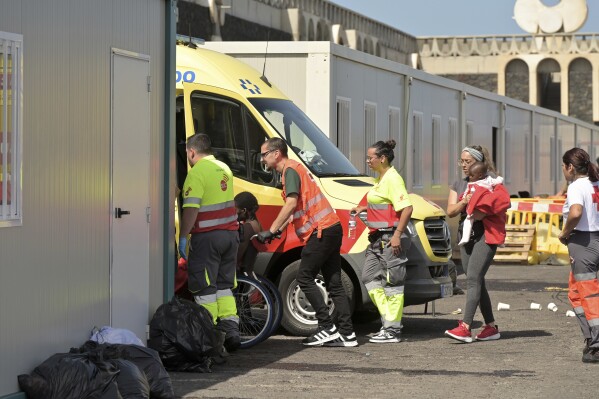 Survivors of a capsized boat are transported by rescue workers in the port of El Hierro in the Canary Islands, Spain, on Wednesday, May 28, 2025. (Fernando Clavijo/Europa Press via AP)