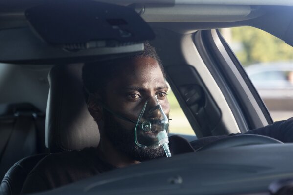 This image released by Warner Bros. Entertainment shows John David Washington in a scene from "Tenet." Warner Bros. says it is delaying the release the Christopher Nolan sci-fi thriller until Aug. 12. (Melinda Sue Gordon/Warner Bros. Entertainment via AP)