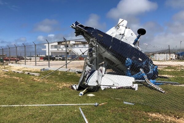 
              A damaged plane sits at the airport after Super Typhoon Yutu hit the U.S. Commonwealth of the Northern Mariana Islands, Friday, Oct. 26, 2018, in Garapan, Saipan. Residents of the U.S. territory are preparing for months without electricity or running water after the islands were slammed Thursday with the strongest storm to hit any part of the U.S. this year. (AP Photo/Dean Sensui)
            