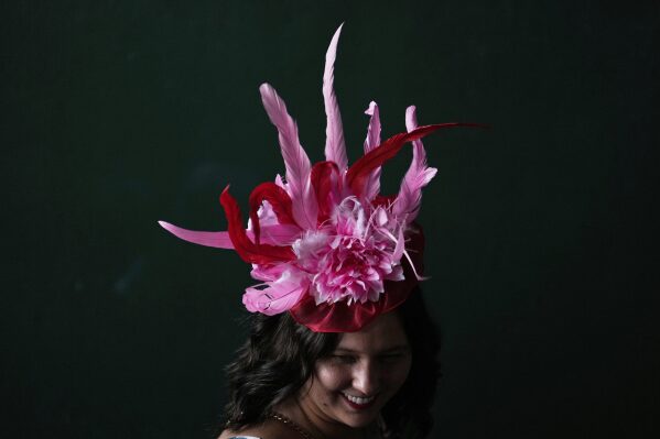 A race fan walk though a tunnel at Churchill Downs before the 151st running of the Kentucky Oaks horse race Friday, May 2, 2025, in Louisville, Ky. (AP Photo/Brynn Anderson)