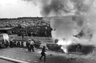 A German Mercedes car somersaulted through the rails after a triple crash in the Le Mans 24-hour race, on June 11, 1955, exploding and killing its driver , Pierre Levegh, and over 80 of the packed crowd of spectators. (ĢӰԺ Photo)