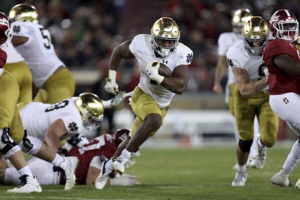 Notre Dame running back Audric Estime (7) runs for a touchdown against Stanford during the second half of an NCAA college football game in Stanford, Calif., Saturday, Nov. 25, 2023. (AP Photo/Jed Jacobsohn)