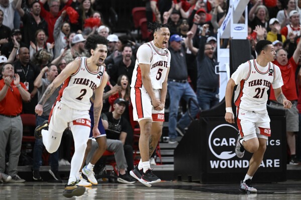 Texas Tech guard Darrion Williams (5) and guard Pop Isaacs (2) celebrate a Tech score against TCU during the second half of an NCAA college basketball game Tuesday, Feb. 20, 2024, in Lubbock, Texas. (AP Photo/Justin Rex)