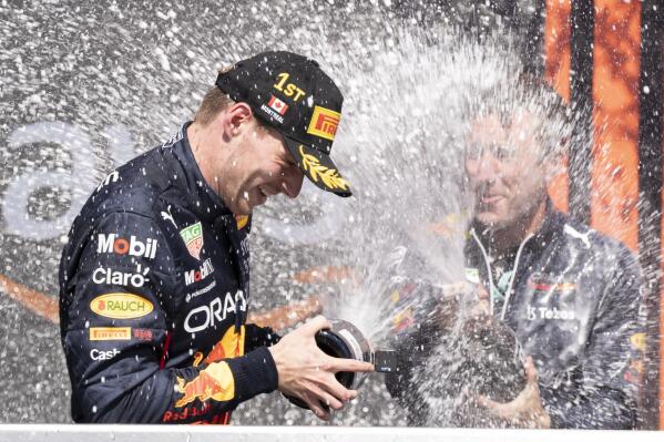 Red Bull Racing Max Verstappen, of the Netherlands, is sprayed with champagne by members of his team after winning the Canadian Grand Prix in Montreal on Sunday, June 19, 2022. (Paul Chiasson/The Canadian Press via AP)