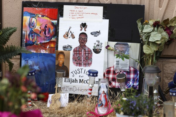 FILE - A makeshift memorial stands at a site across the street from where Elijah McClain was stopped by Aurora, Colo., Police Department officers before family members hold a news conference, July 3, 2020, in Aurora, Colo. Lawyers are to deliver closing arguments Tuesday, Oct. 10, 2023, in the trial of the first two police officers to be prosecuted in the 2019 death of McClain, a Black man who was put in a neck hold and pinned down by officers in the Denver suburb of Aurora before paramedics injected him with a powerful sedative. (AP Photo/David Zalubowski, File)