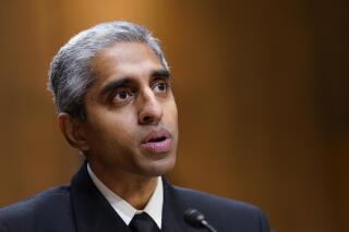 FILE - Surgeon General Dr. Vivek Murthy testifies before the Senate Finance Committee on Capitol Hill in Washington, on Feb. 8, 2022, on youth mental health care. Widespread loneliness in the U.S. is posing health risks as deadly as smoking a dozen cigarettes daily, costing the health industry billions of dollars annually, the U.S. surgeon general said Tuesday in declaring the latest public health epidemic. About half of U.S. adults say they’ve experienced loneliness, Murthy said in a new, 81-page report from his office. (AP Photo/Susan Walsh, File)
