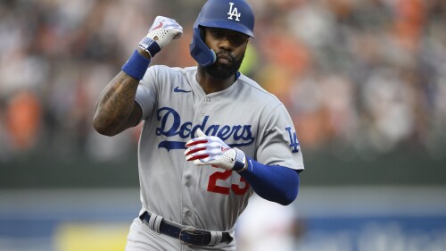 Los Angeles Dodgers' Jason Heyward gestures as he rounds the bases on his three-run home run during the second inning of a baseball game against the Baltimore Orioles, Tuesday, July 18, 2023, in Baltimore. (AP Photo/Nick Wass)