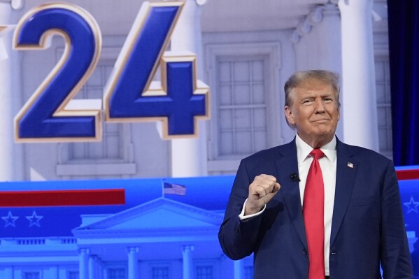 Republican presidential candidate former President Donald Trump arrives for a Fox News Channel town hall in Des Moines, Iowa, Wednesday, Jan. 10, 2024. (AP Photo/Carolyn Kaster)