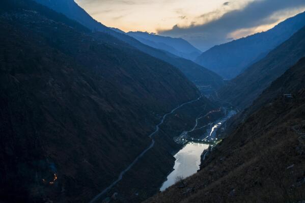 Nathpa-Jhakri dam is visible in the valley in Kinnaur district of the Himalayan state of Himachal Pradesh, India, Sunday, March 12, 2023. A favorite initiative of Indian governments, the push for dams has skyrocketed as the nation looks for round-the-clock energy that doesn't spew planet-warming emissions. (AP Photo/Ashwini Bhatia)