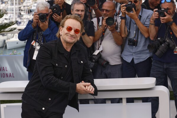 Bono poses for photographers at the photo Call for the Film 'Bono: Stories of Surrender' at the 78th International Film Festival, Cannes, southern France, Saturday, May 17, 2025. (Photo by Joel C Ryan/Invision/AP)