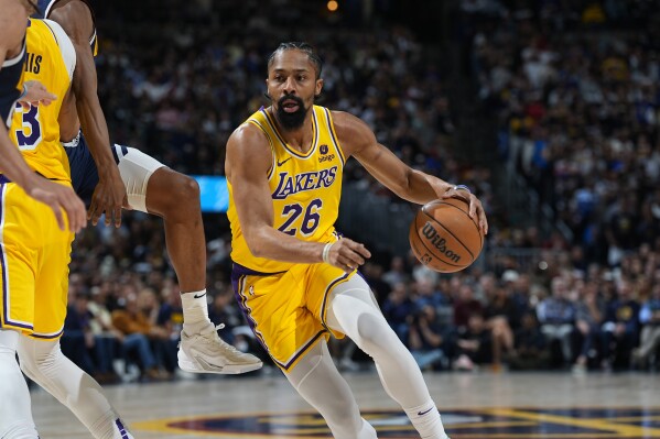 FILE - Los Angeles Lakers guard Spencer Dinwiddie (26) in the second half of Game 5 of an NBA basketball first-round playoff series Monday, April 29, 2024, in Denver. The Dallas Mavericks are bringing back Spencer Dinwiddie in a reunion with the guard who played a key role in the club's run to the 2022 Western Conference finals. (AP Photo/David Zalubowski, File)