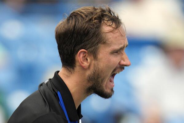 Daniil Medvedev, of Russia, reacts after scoring a point against Taylor Fritz, of the United States, during a quarterfinal match at the Western & Southern Open tennis tournament Friday, Aug. 19, 2022, in Mason, Ohio. (AP Photo/Jeff Dean)